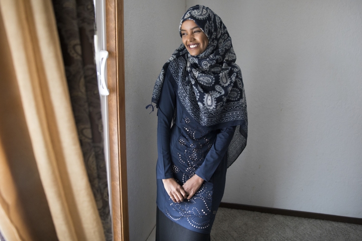 Halima Aden tried on at home the burkini she will wear for the Miss Minnesota pageant. At her mother’s request, she added a long skirt to cover the pants of the burkini, which her mother thought immodest.